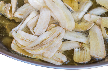 Sliced banana frying in hot oil to be snackの写真素材