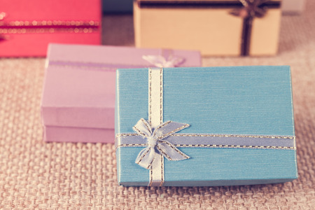 Small gift box set on sack cloth background,vintage toneの写真素材