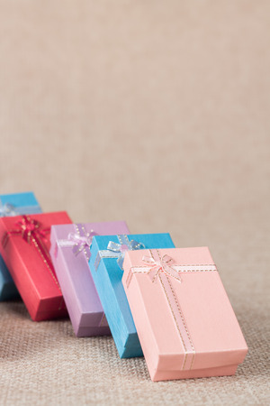 Small gift box set on sack cloth background,vintage toneの写真素材