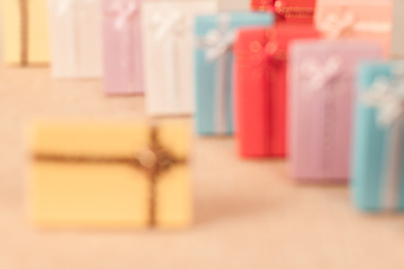 Defocus of small gift box set on sack cloth background,vintage tone