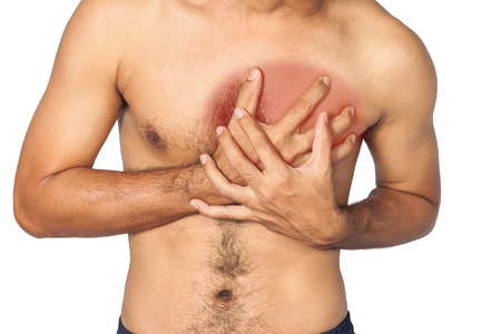 Young man having heart attackの写真素材