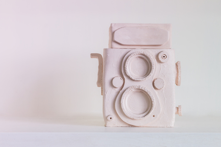 Handmade tradition porcelain of vintage camera on shelfの写真素材