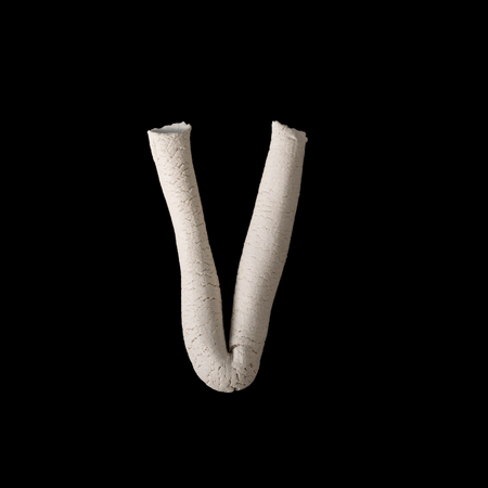 Alphabet V mold by clay on black with clipping pathの写真素材