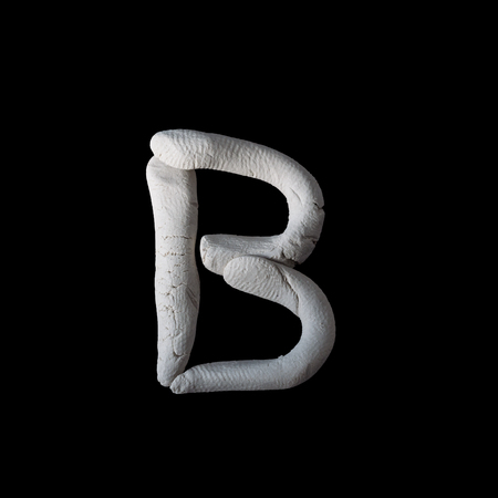 Alphabet B mold by clay on black with clipping pathの写真素材