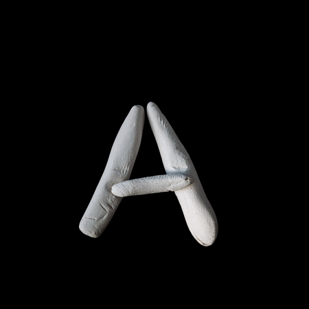 Alphabet A mold by clay on black with clipping pathの写真素材