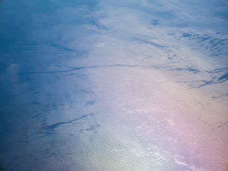 Cloud and sky high view from airplaneの写真素材