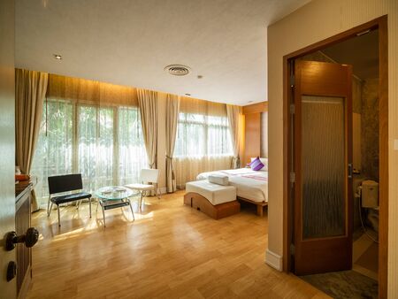 Luxury bedroom with warm light of hotel resort.の写真素材