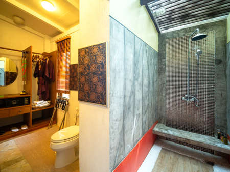 Luxury bathroom with sanitary ware in warm light.の写真素材