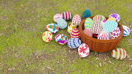 Top view of set of colorful easter eggs place in brown wicker basket on ground with green grass. 3D illustration.の写真素材