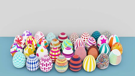 Top view of set of colorful easter eggs place on blue ground and white background. 3D illustration.の写真素材