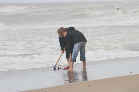 two blonde sisters on the beach の写真素材