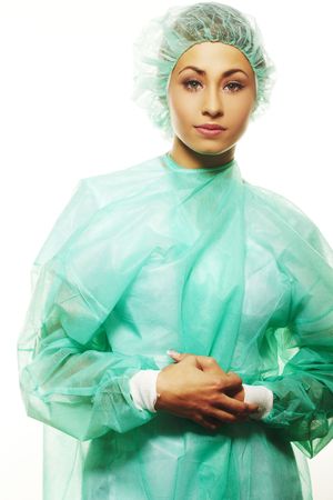 A friendly surgical nurse in scrubs and a hairnetの写真素材