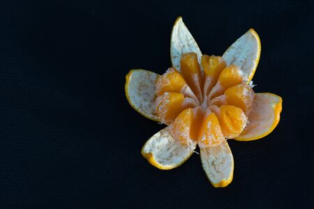 Open tangerine on the tableの写真素材
