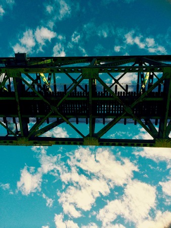 Traveling under Railway Bridge by boat