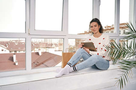 Woman with credit card and tablet buying in internet. Shopping onlineの写真素材