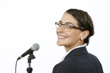 Sucssesful businesswomen keynote speaker in front of microphone before public speakingの写真素材