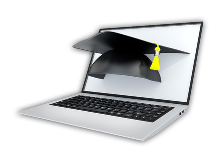Online learning concept. Graduate cap pops out of a laptop screen.の写真素材