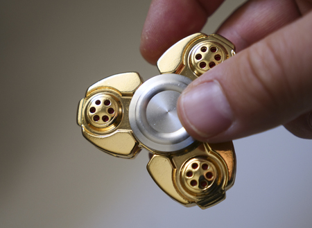Fidget spinner stress relieving toy close upの写真素材