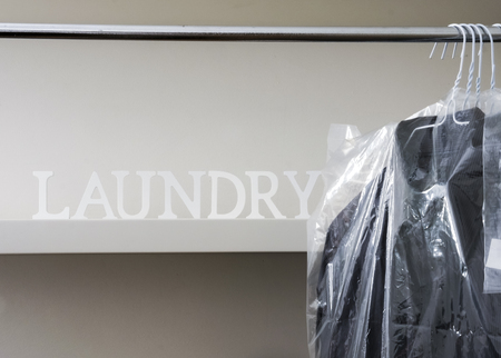 Ironed And Packed Men Shirts Hanged On Rackの写真素材