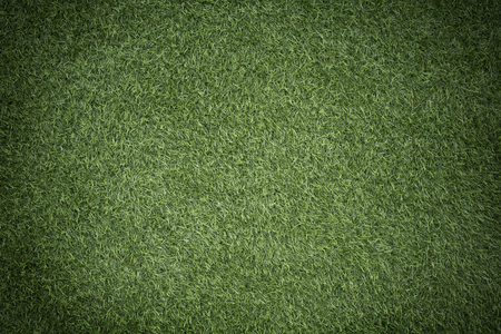 photo of a green grass with vignette effect (Artificial turf)の写真素材