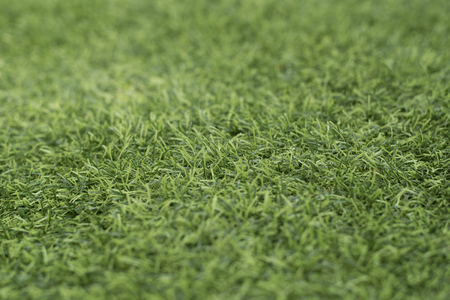 close up photo of a green grass (Artificial turf)の写真素材