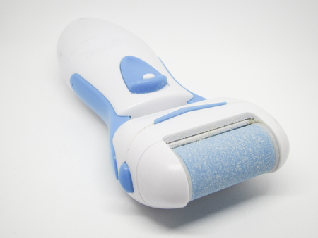 Electric foot file on a white background (selective focus)の写真素材