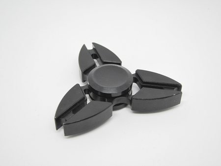 Fidget spinner on a white background (selective focus)の写真素材
