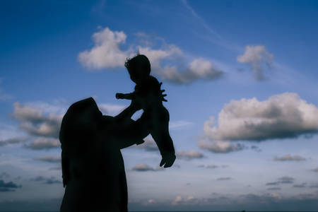 silhouette photo of mother and daughter having fun time togetherの写真素材