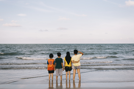 kids standing at the beach enjoying sea views.friendship concept.family concept.holiday conceptのeditorial素材