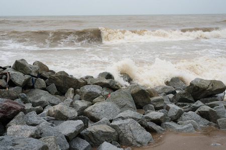 wave and splashes on beach of Pantai Cinta Berahi,Kelantan,Malaysia. Bad weather monsoon seasonの写真素材