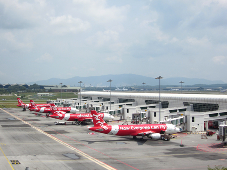 Sepang,Selangor,Malaysia - December 17th 2017 : airbus plane own by airasia park and waiting to be boarded at Kuala Lumpur International Airport ( KLIA )のeditorial素材