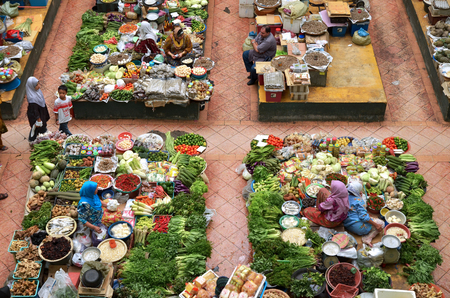 Kota Bharu,Kelantan,Malaysia - December 12th 2012 : seller and the interior environment Pasar besar siti khadijah fresh market located in Kota Bharu, Kelantan, Malaysiaのeditorial素材