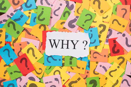 colourful paper note with question mark and white paper with word WHY. why concept backgroundの写真素材