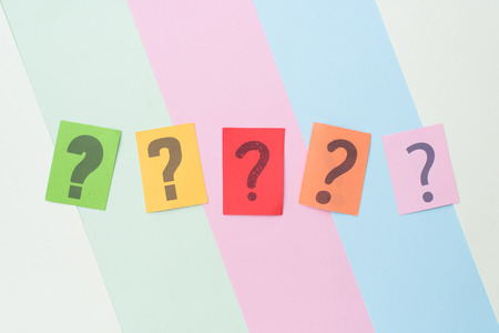 colorful paper with QUESTION MARK on multicolored pastel color background. FAQ,Q&A,Mystery and...