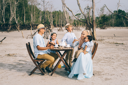happy asian family having a good moment of happiness picnic outdoor. family,love and relationship conceptの写真素材