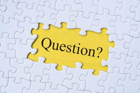 question word on jigsaw puzzle with yellow background. questions, faq, q&a, business conceptの写真素材