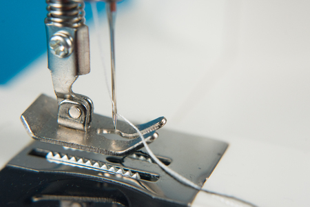 closeup of sewing machine presser foot and needle. tailor and fashion conceptの写真素材
