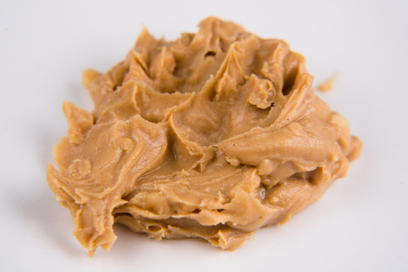 closeup of a peanut butter over white background. selective focusの写真素材