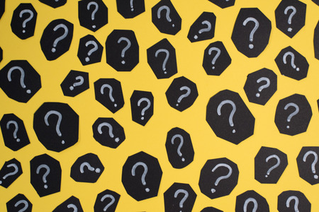 full frame image of black paper card with QUESTION MARK on yellow background. Concept of FAQ, Q&A, Problems and Questions backgroundの写真素材