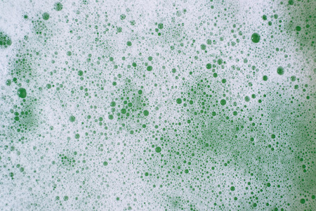 Full frame image of a bubbles or foamy soapy water for background. Concept of abstract and hygieneの写真素材