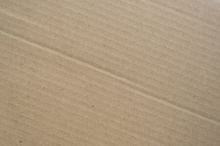 Brown corrugated cardboard box background. Concept of packaging and shippingの写真素材