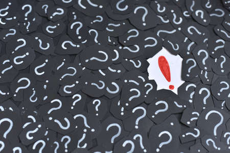Exclamation mark on a question mark background. Concept of decision, faq, q&a and riddleの写真素材