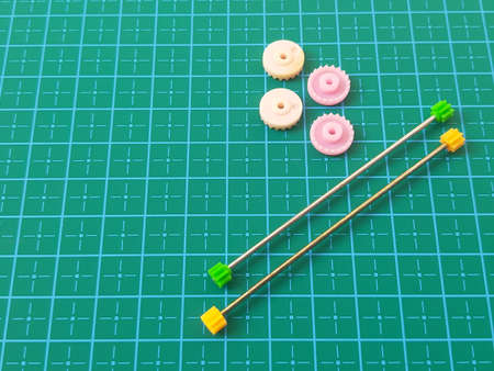 Gear toys on cutting mat backgroundの写真素材