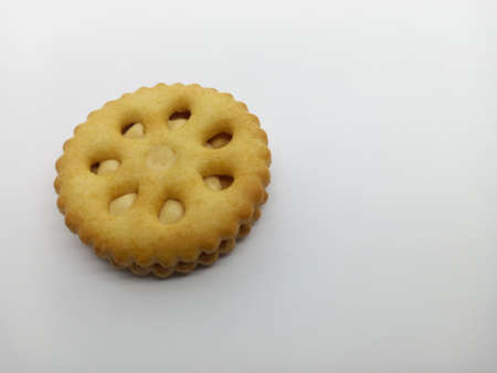 Closeup photo Peanut butter on biscuit sandwich with white backgroundの写真素材