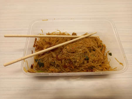 Vermicelli fried or called bihun goreng served in a plastic box with top view photoの写真素材