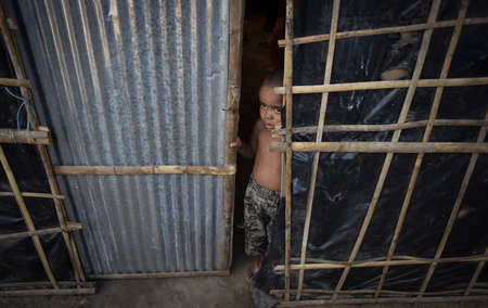 COX' BAZAR, BANGLADESH - APRIL 15, 2020 : Rohingya refugee boy from Myanmar in Kutupalong refugee camp near Cox's Bazar, Bangladesh.のeditorial素材