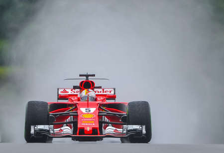 KUALA LUMPUR, MALAYSIA - SEPTEMBER 29, 2017 Sebastian Vettel of Germany driving the (5) Scuderia Ferrari SF70H on track during practice for the Malaysia Formula One Grand Prix at Sepang Circuitのeditorial素材