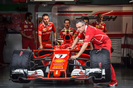 KUALA LUMPUR, MALAYSIA - SEPTEMBER 28, 2017 : Mechanics attend to Ferrari during Malaysia Formula One Grand Prix at Sepang Circuit.のeditorial素材