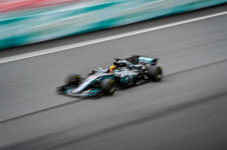 KUALA LUMPUR, MALAYSIA - OCTOBER 1, 2017 : Lewis Hamilton of Great Britain Mercedes AMG Petronas F1 Team on track with slow motion during Malaysia Formula One Grand Prix at Sepang Circuit.のeditorial素材