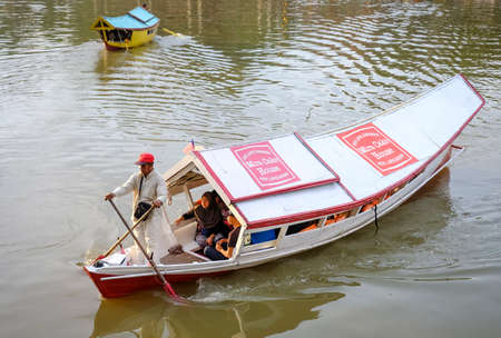KUCHING SARAWAK MALAYSIA - OCTOBER 26, 2017. Traditional wooden boat at Kuching Waterfront Sarawak...